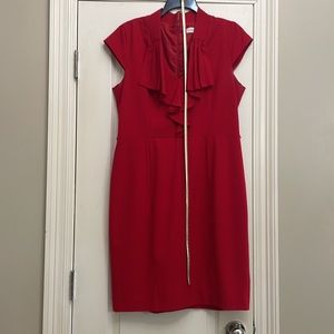 Red dress. Zip back with Golf belt. Ruffled v neck lined